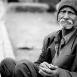 Economy Crisis - Grayscale Photography of Man Sitting