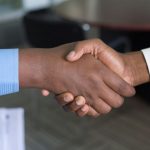 Buyer's Market - two person handshaking