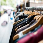 Slow Market - selective focus photography of hanged clothes