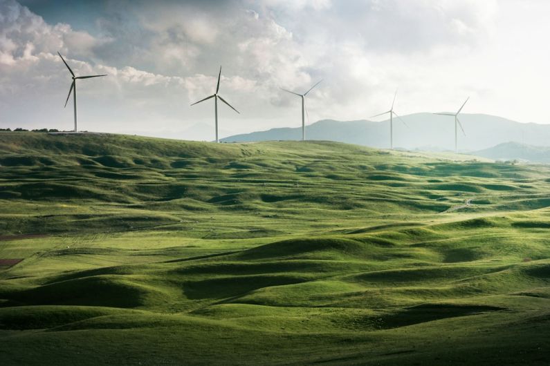 Energy Efficiency - wind turbine surrounded by grass