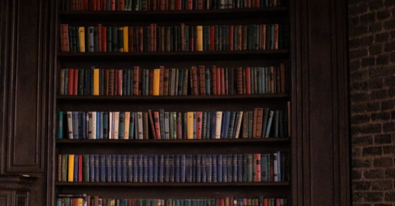 Legal Book - A Woman Sitting at the Table