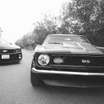 Cultural Difference - Modern and retro cars on asphalt road