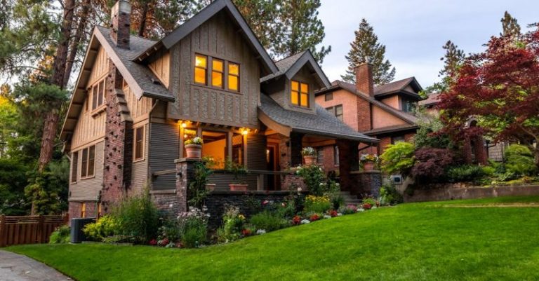 Mortgage Rates - Brown Concrete House Near Green Grass Field