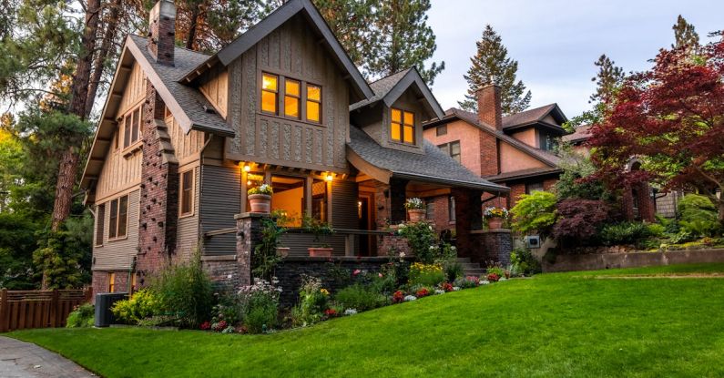 Mortgage Rates - Brown Concrete House Near Green Grass Field