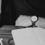 Tax Document - Crop pondering man analyzing expenses and taking notes