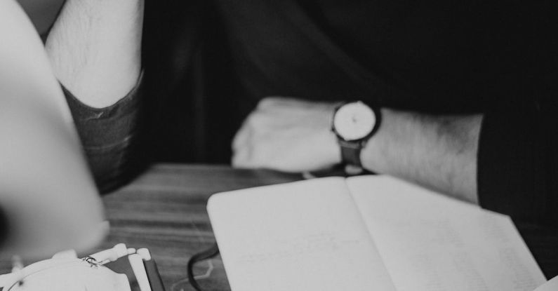 Tax Document - Crop pondering man analyzing expenses and taking notes