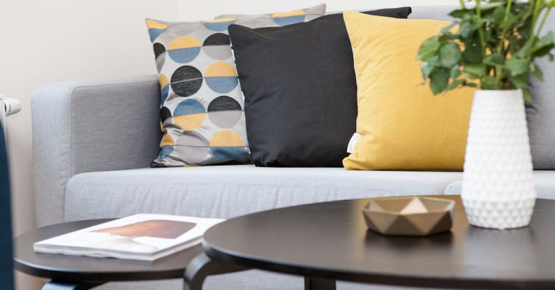 Home Staging - Centerpiece on Coffee Table Beside Sofa With Three Pillows