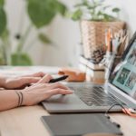 Professional Photography - Woman working retouching photo on laptop at convenient workplace