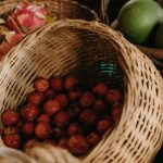Slow Market - A table with baskets of fruit and vegetables