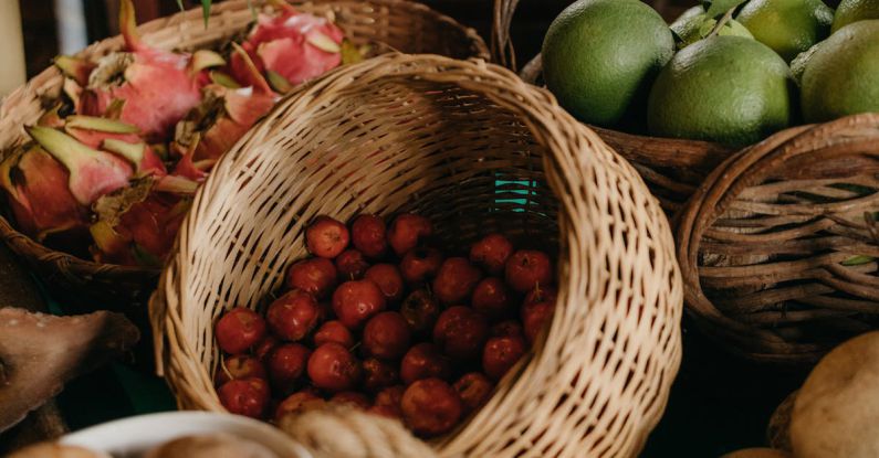 Slow Market - A table with baskets of fruit and vegetables