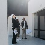 Agent Choice - Clients and Real Estate Agent Looking at Roof of House for Sale