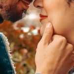 Tenant Relationship - A couple is kissing in front of a tree