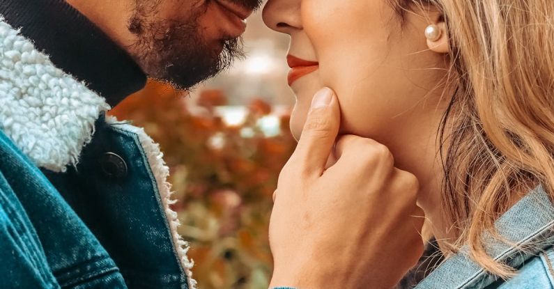 Tenant Relationship - A couple is kissing in front of a tree