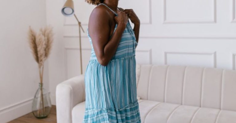 Tenant Retention - Smiling Woman in Dress in Bright Living Room