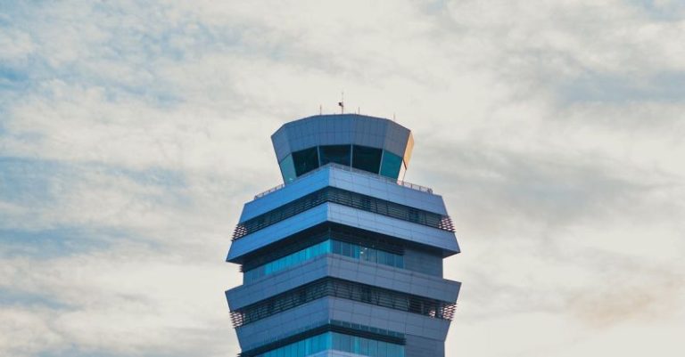Rent Control - An airport control tower with a blue sky in the background