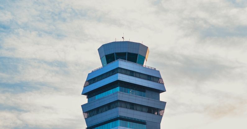 Rent Control - An airport control tower with a blue sky in the background