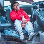 Emergency Repair - Man in Red Coat Sitting on Broken Car Seat