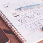 Website Design - Notebook Beside the Iphone on Table