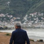 Lead Generation - Unrecognizable man wearing mask and child walking together on embankment