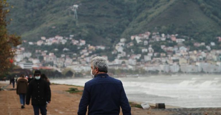Lead Generation - Unrecognizable man wearing mask and child walking together on embankment