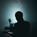 Photography Videography - Silhouette of Man Standing in Front of Microphone