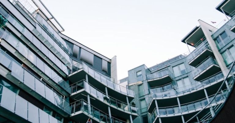 Commercial Residential - Modern geometric glass building with balconies