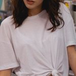 Rental Yield - Shallow Focus Photo of Woman in White T-shirt