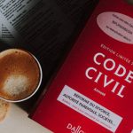 Legal Book - Cup of cappuccino and cookie placed near book on desk