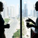 Large-scale Project - Multiethnic women talking about business project in modern office