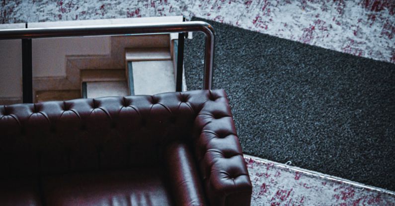 Residential Design - Leather Sofa and an Armchair in a Living Room