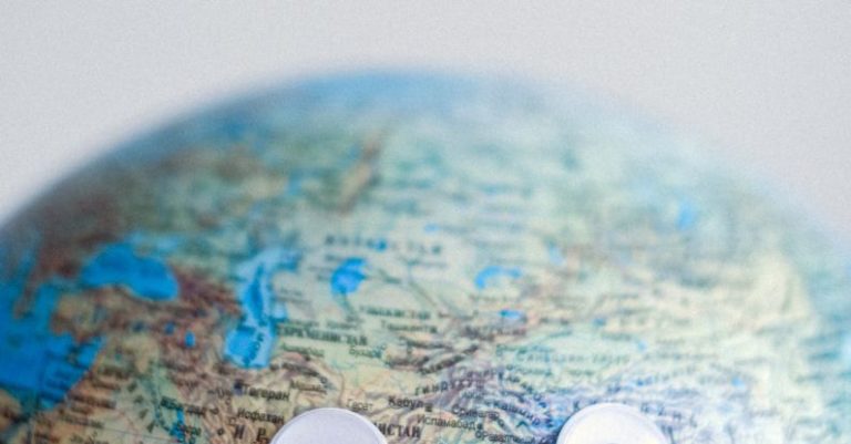 Globalization Impact - Model of globe with googly eyes representing Earth as character with need of protection