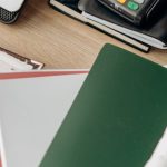 Tech Management - Computer Laptop and Notebooks on a Wooden Desk