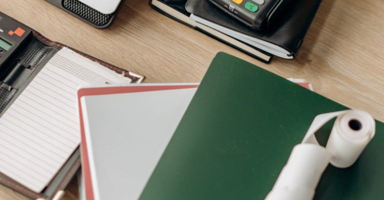 Tech Management - Computer Laptop and Notebooks on a Wooden Desk